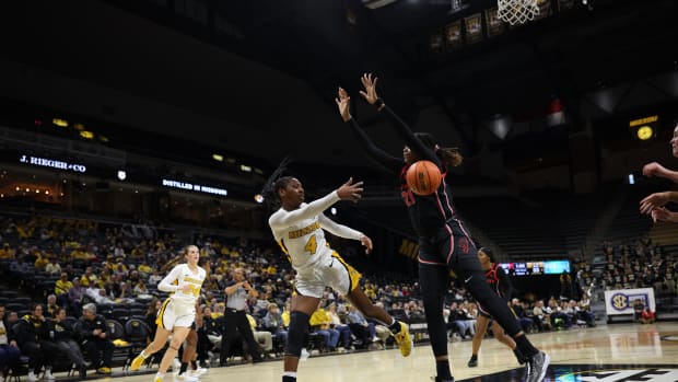 Missouri senior guard Mama Dembele with the pass against Georgia.